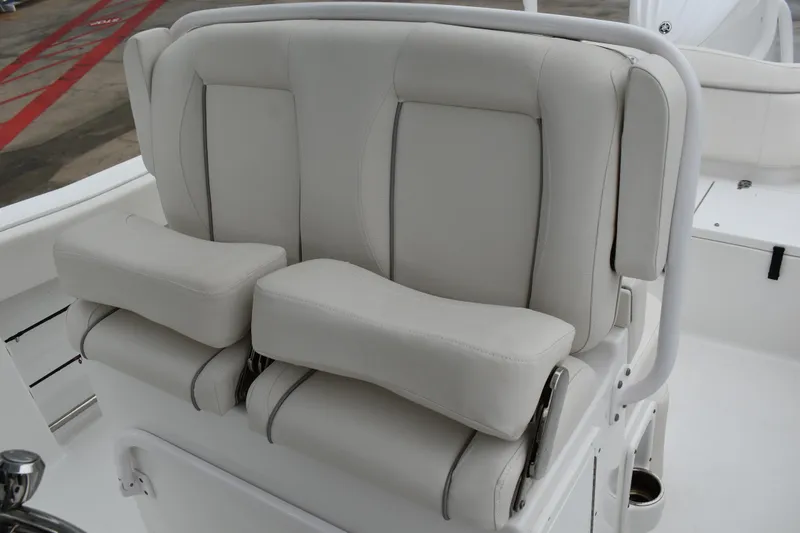 Slide: The Image of 2023 Sea Hunt Ultra 255 SE boat seat with cushioned armrests. - 33