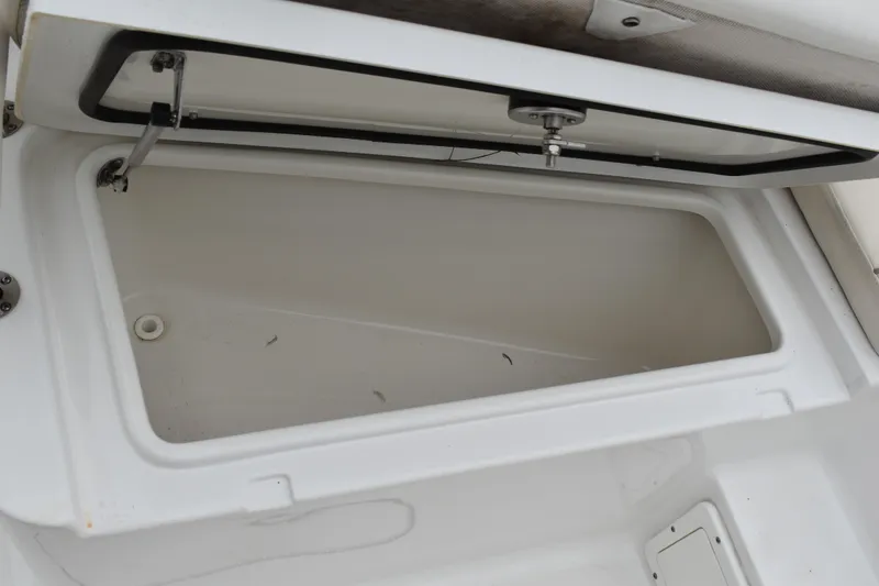 Slide: The Image of Open storage compartment on 2023 Sea Hunt Ultra 255 SE boat. - 36