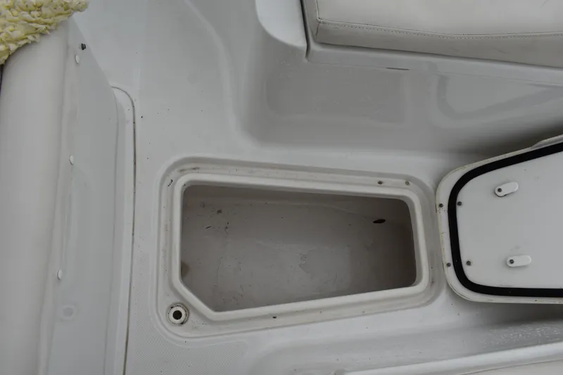 Slide: The Image of Storage compartment on 2023 Sea Hunt Ultra 255 SE boat, open and empty. - 37