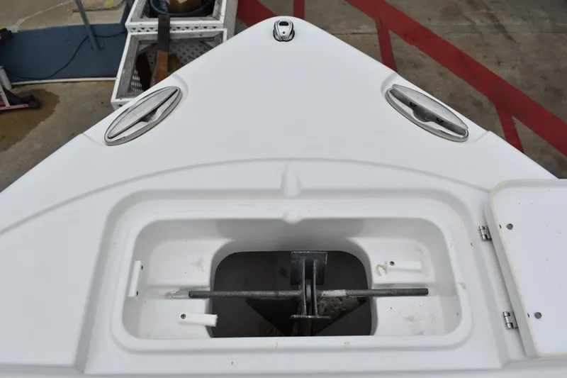 Slide: The Image of Bow anchor compartment of 2023 Sea Hunt Ultra 255 SE boat. - 39
