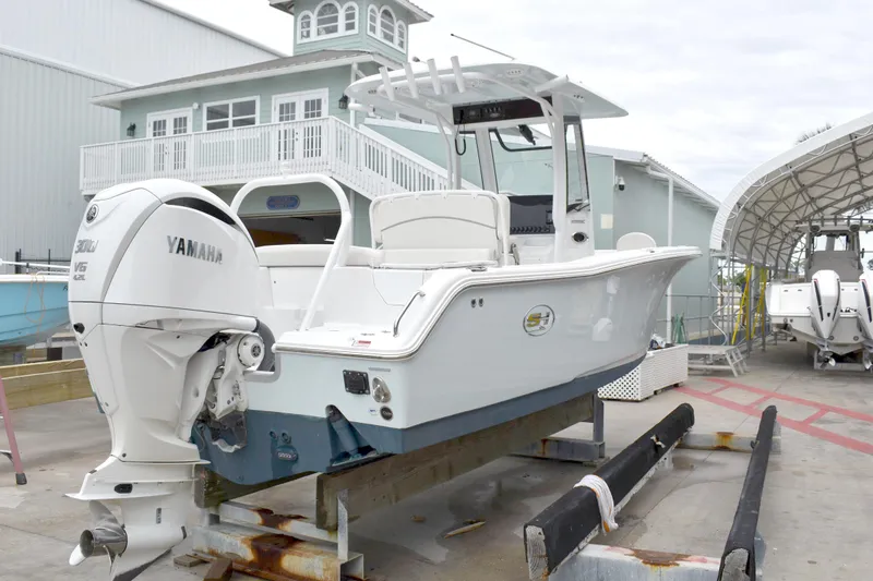 Slide: The Image of 2023 Sea Hunt Ultra 255 SE boat with Yamaha engine on display. - 53