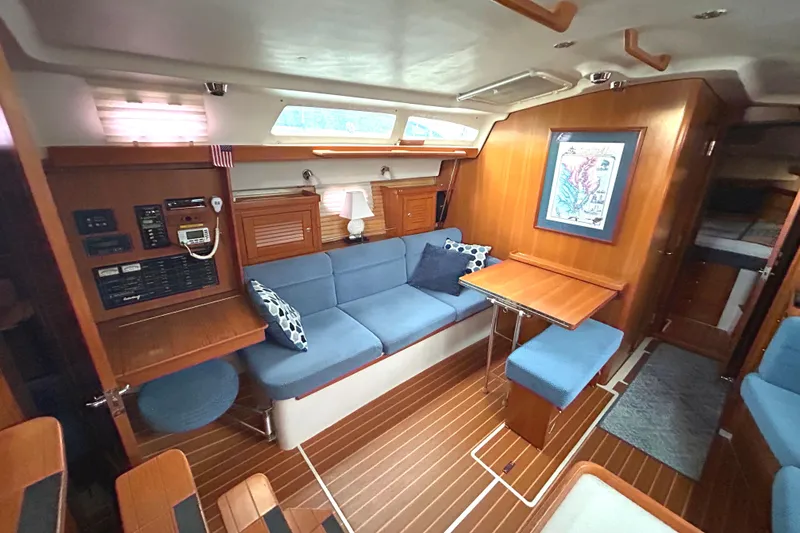 Slide: The Image of Interior of 2009 Catalina 375 sailboat with cozy seating and wooden finishes. - 16