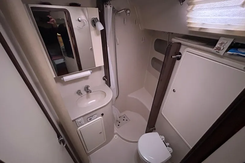 Slide: The Image of Compact bathroom in 2009 Catalina 375 sailboat with sink, toilet, and shower. - 20
