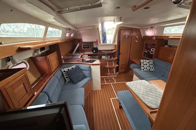 Slide: The Image of Interior of 2009 Catalina 375 sailboat with cozy seating and wooden finishes. - 24