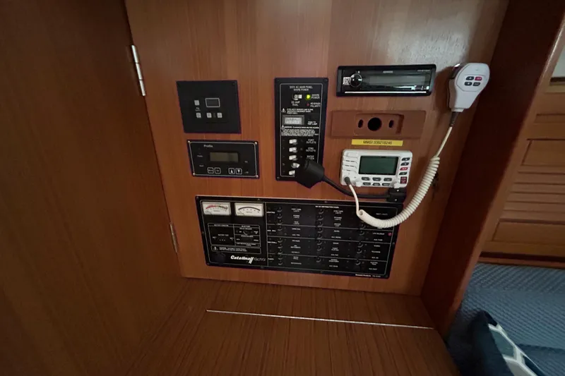 Slide: The Image of Control panel of a 2009 Catalina 375 yacht with various instruments and gauges. - 26