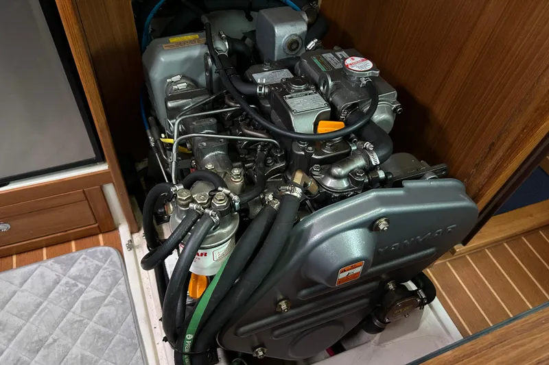 Slide: The Image of Engine compartment of a 2009 Catalina 375 sailboat, featuring a Yanmar engine. - 28