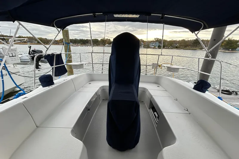 Slide: The Image of Cockpit of 2009 Catalina 375 sailboat with covered helm, docked by the water. - 30