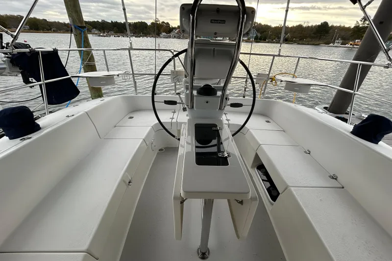Slide: The Image of Cockpit of 2009 Catalina 375 sailboat with steering wheel, seating, and water view. - 31