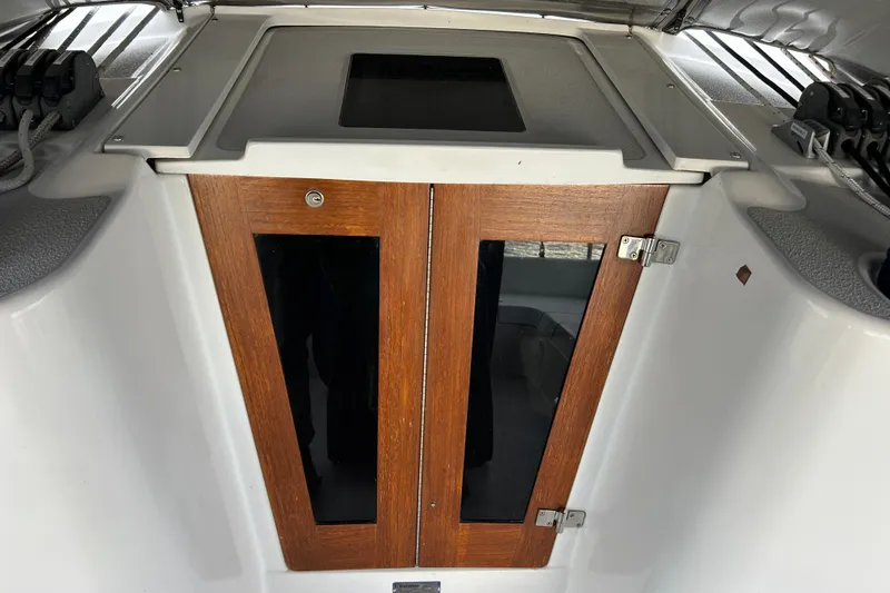 Slide: The Image of Wooden cabin doors on a 2009 Catalina 375 sailboat, featuring sleek design and modern hardware. - 6