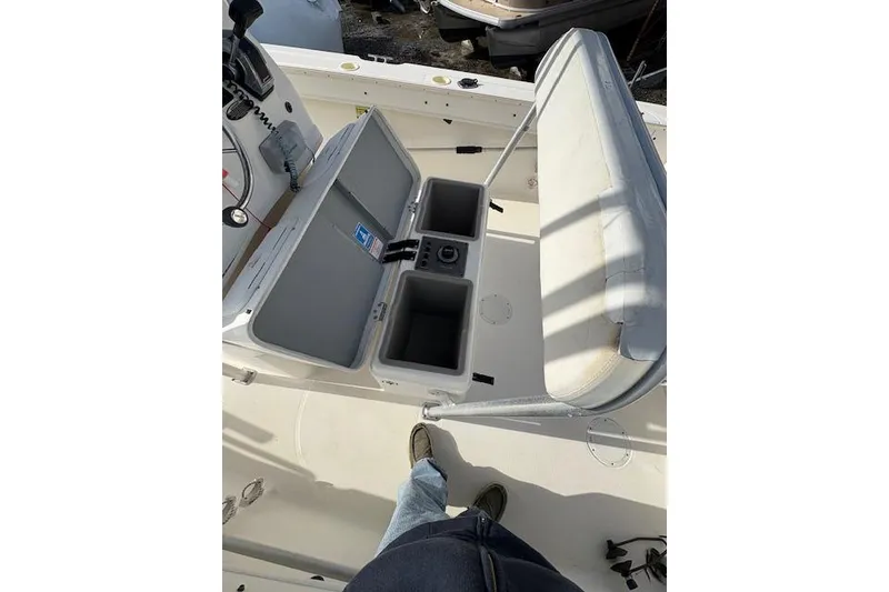 Slide: The Image of 2006 Trophy PRO 23 Center Console boat interior with open storage compartments. - 11