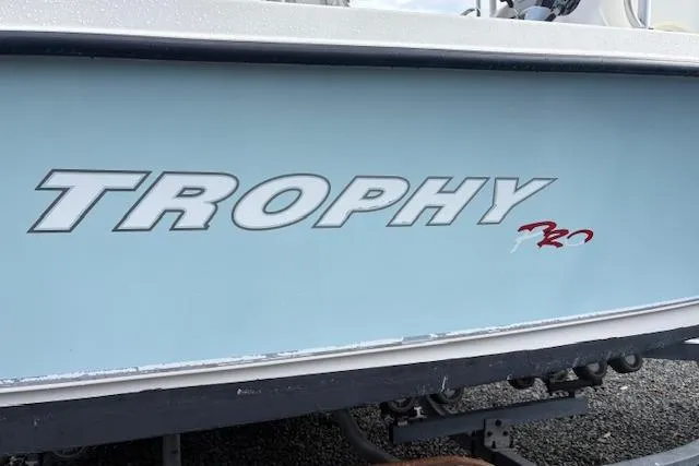 Slide: The Image of 2006 Trophy PRO 23 Center Console boat side view with logo. - 13