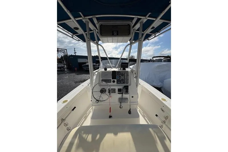 Slide: The Image of 2006 Trophy PRO 23 Center Console boat interior with steering wheel and control panel. - 3