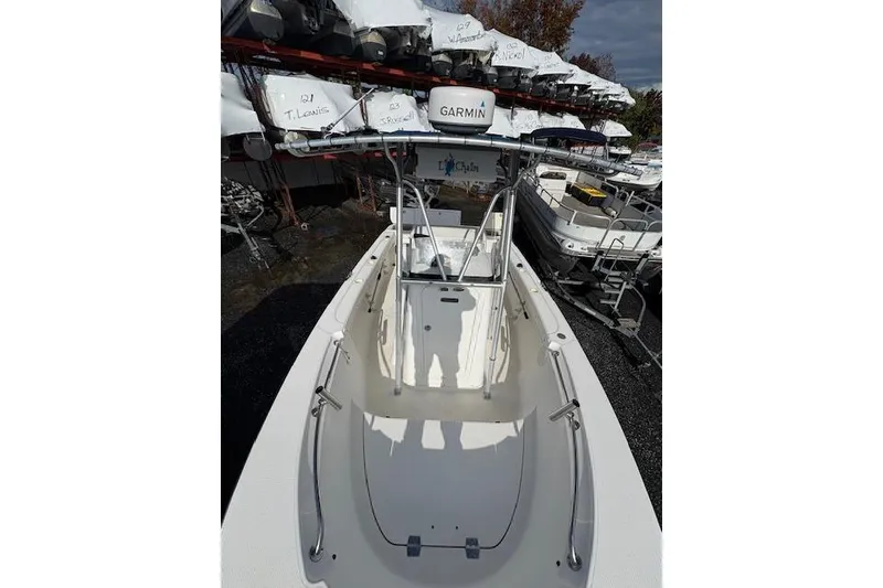 Slide: The Image of 2006 Trophy PRO 23 Center Console boat with Garmin equipment, docked in a marina. - 4