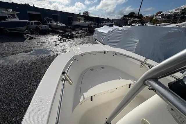 Slide: The Image of 2006 Trophy PRO 23 Center Console boat in storage yard, partially covered. - 8