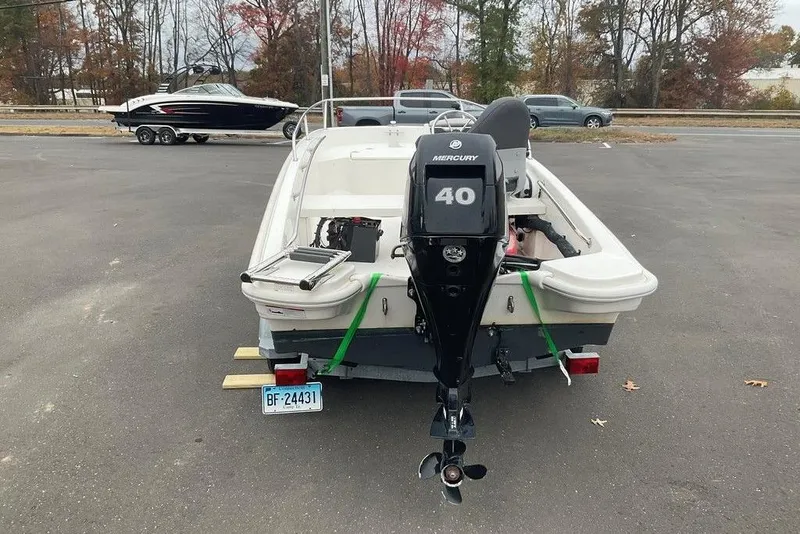 Slide: The Image of 2020 Boston Whaler 130 Super Sport with Mercury 40 engine in parking lot. - 3