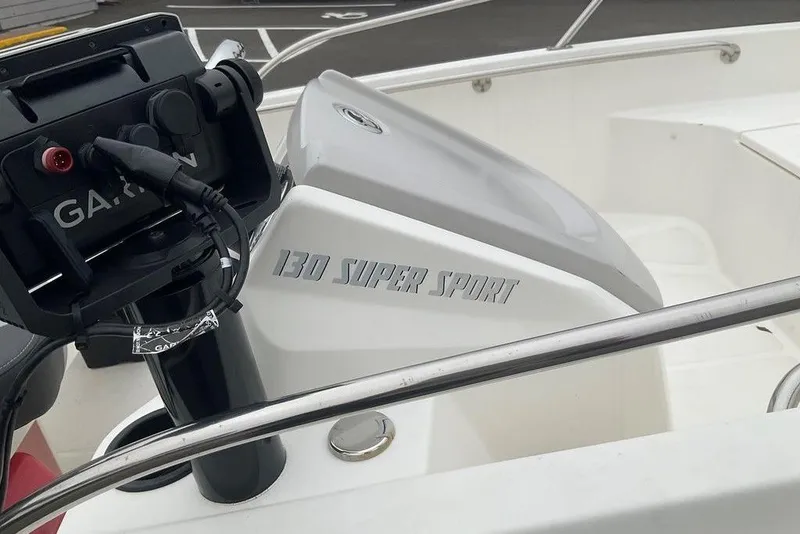 Slide: The Image of 2020 Boston Whaler 130 Super Sport boat console with Garmin equipment. - 5