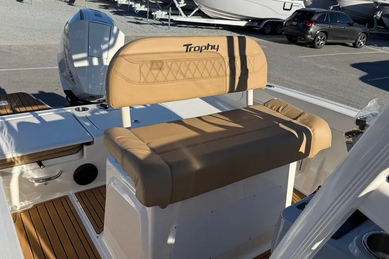 Slide: The Image of 2026 Bayliner Trophy T22CC boat interior with tan seating and modern design. - 18