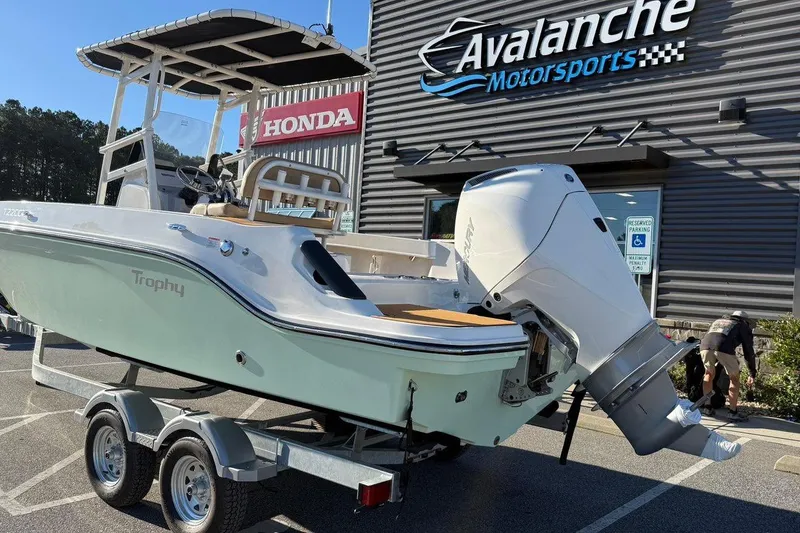 Slide: The Image of 2026 Bayliner Trophy T22CC boat on trailer at Avalanche Motorsports dealership. - 4