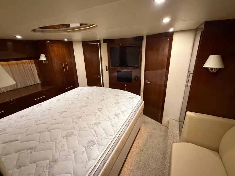 Slide: The Image of Luxurious bedroom interior of 2014 Regal 52 Sport Coupe yacht with elegant wood finishes. - 29