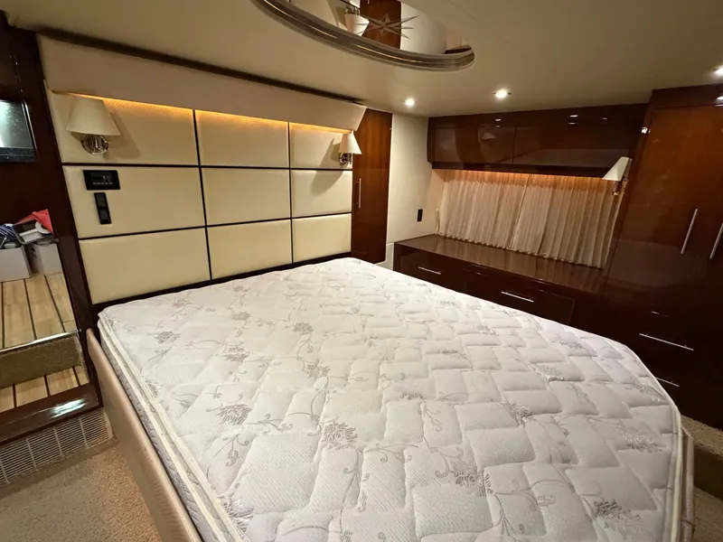 Slide: The Image of Luxurious bedroom interior of 2014 Regal 52 Sport Coupe yacht with elegant furnishings. - 30