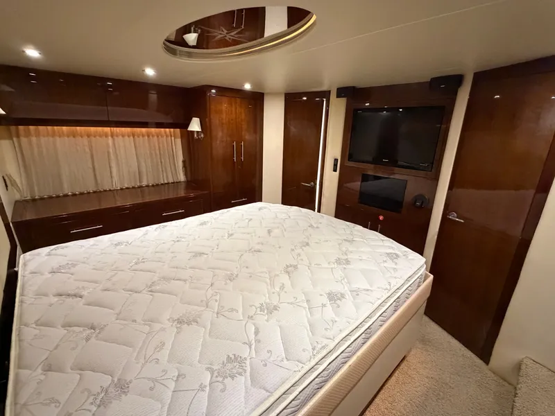 Slide: The Image of Luxurious bedroom interior of 2014 Regal 52 Sport Coupe yacht with elegant wood finishes. - 31