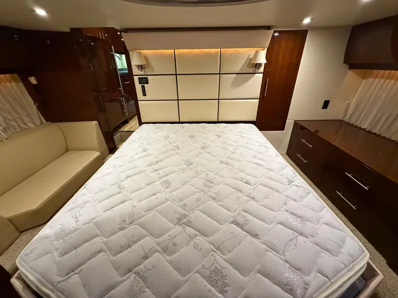 Slide: The Image of Luxurious bedroom interior of 2014 Regal 52 Sport Coupe yacht with elegant furnishings. - 36