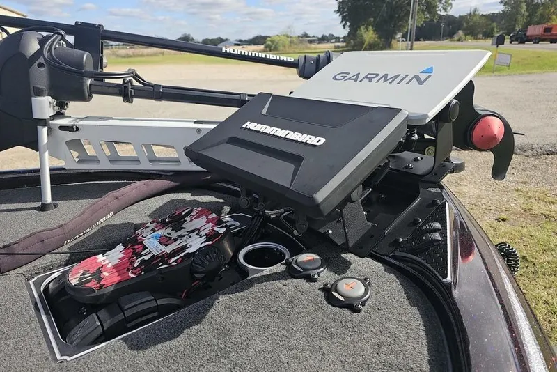 Slide: The Image of 2019 Skeeter FX21 boat with Garmin and Humminbird electronics on deck. - 2