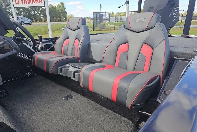 Slide: The Image of 2019 Skeeter FX21 boat interior with gray and red seats, Yamaha sign visible. - 3