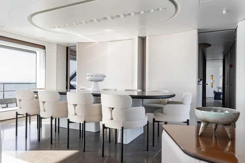 Slide: The Image of Luxurious dining area on 2024 Azimut Grande 36M yacht with elegant seating and ocean view. - 16