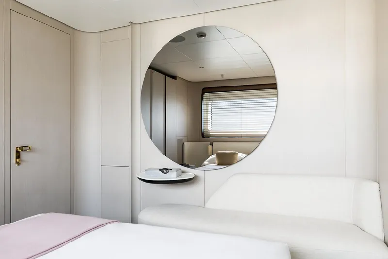 Slide: The Image of 2024 Azimut Grande 36M yacht interior with modern decor and circular mirror. - 31