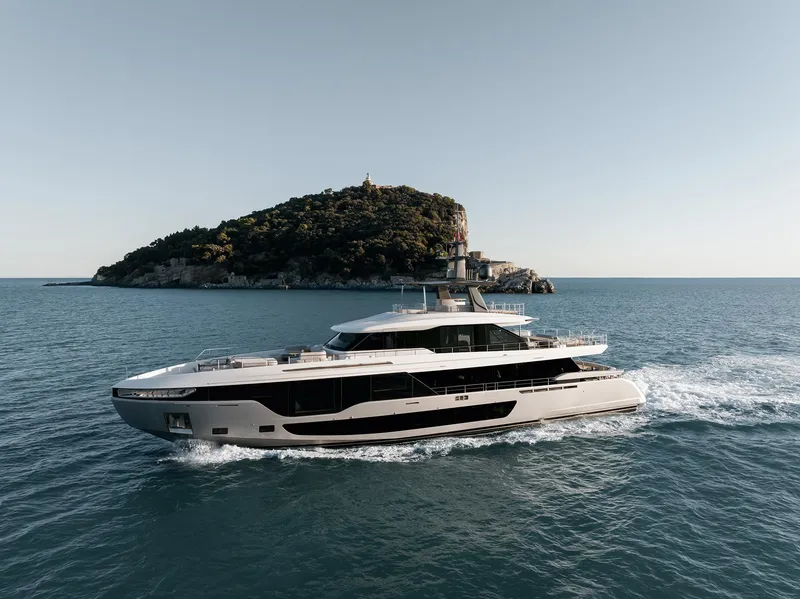 Slide: The Image of 2024 Azimut Grande 36M yacht cruising near a small island in open water. - 34