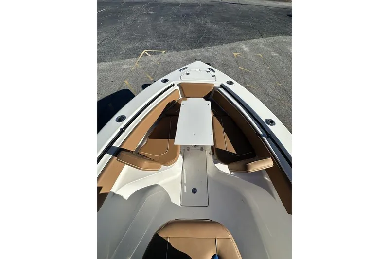 Slide: The Image of 2026 Key West 239 FSR boat with Yamaha engine on trailer, parked outdoors. - 13