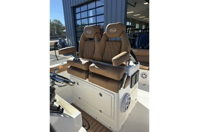 Slide: The Image of 2026 Key West 239 FSR boat interior with tan seating and modern design. - 16