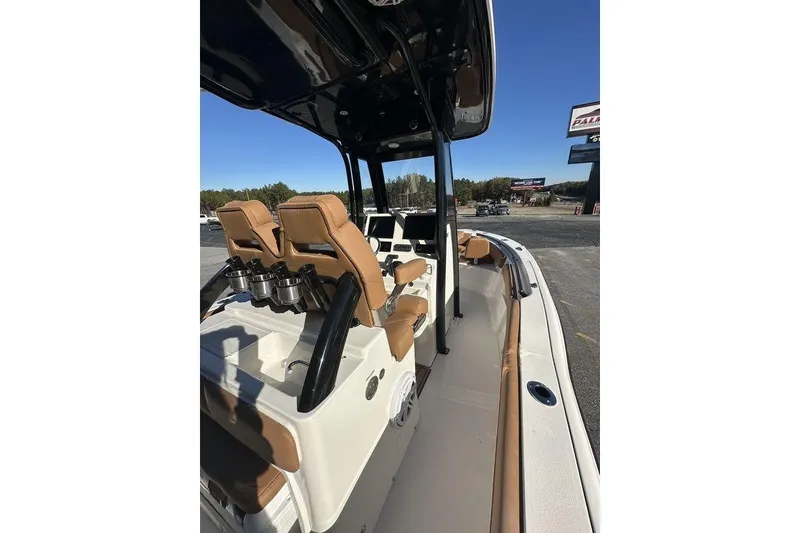 Slide: The Image of 2026 Key West 239 FSR boat interior with tan seating and white table. - 7