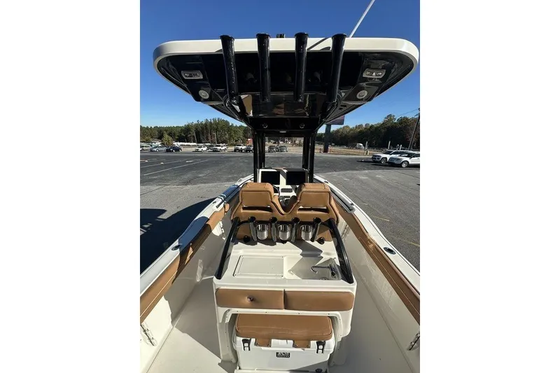 Slide: The Image of 2026 Key West 239 FSR boat on trailer with Yamaha engine, American flag in background. - 8