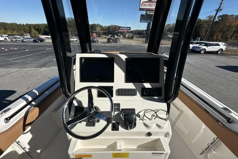 Slide: The Image of 2026 Key West 239 FSR boat with luxurious tan seating and modern design. - 9