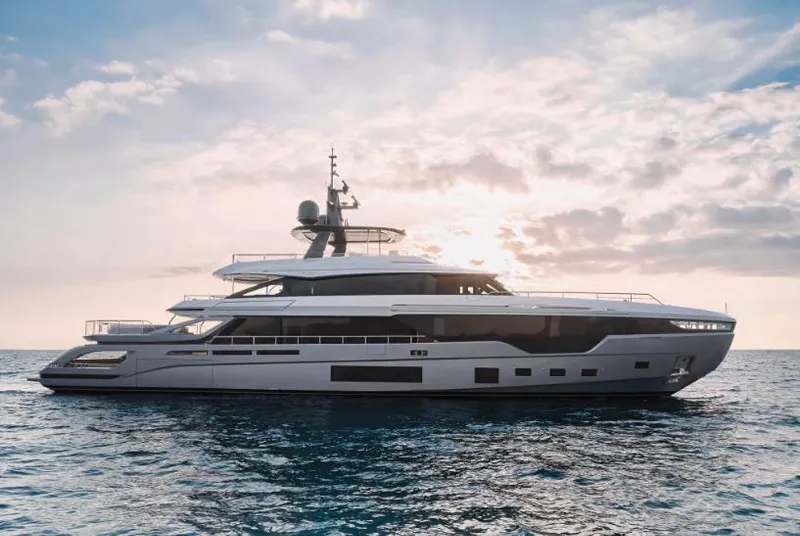 Slide: The Image of Luxurious 2027 Azimut 38M Grande Trideck yacht on serene ocean at sunset. - 3