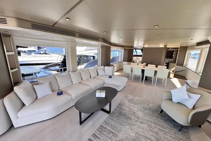 Slide: The Image of Luxurious interior of 2026 Azimut Grande Magellano 25 Metri yacht with elegant seating and dining area. - 14