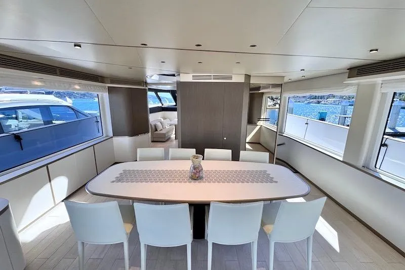 Slide: The Image of Luxurious dining area on 2026 Azimut Grande Magellano 25 Metri yacht with panoramic windows. - 15