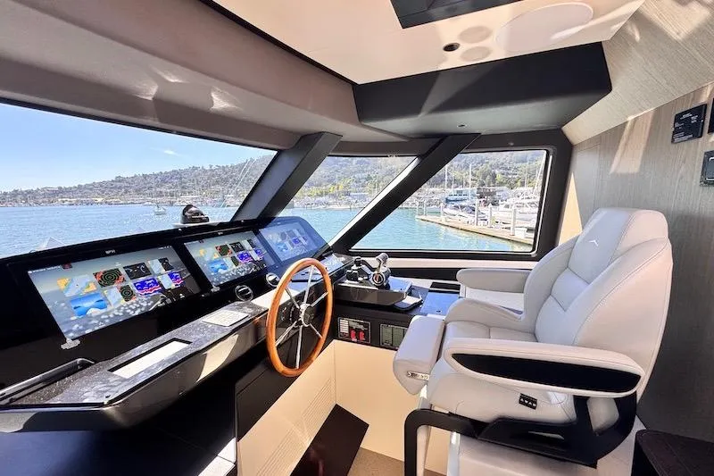 Slide: The Image of Luxurious helm of 2026 Azimut Grande Magellano 25 Metri yacht with advanced navigation displays. - 29