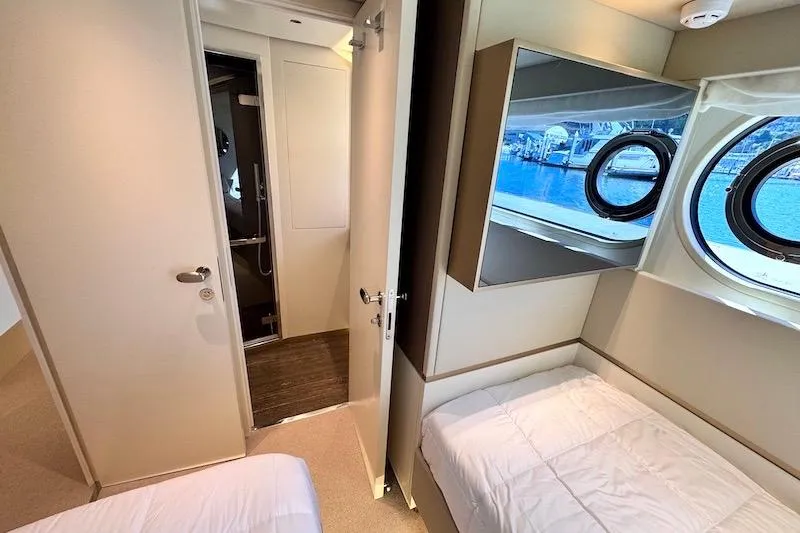 Slide: The Image of Luxurious cabin interior of 2026 Azimut Grande Magellano 25 Metri yacht with porthole view. - 61