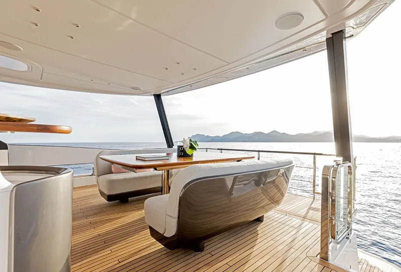 Slide: The Image of Luxury deck of 2025 Azimut Grande 26M yacht with elegant seating and ocean view. - 10