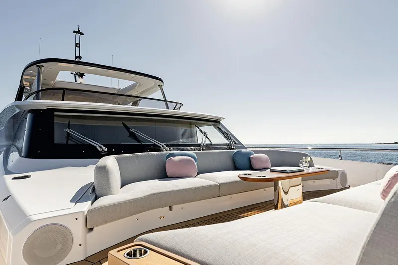 Slide: The Image of Luxurious Azimut Grande 26M yacht deck, 2025 model, with elegant seating and ocean view. - 31