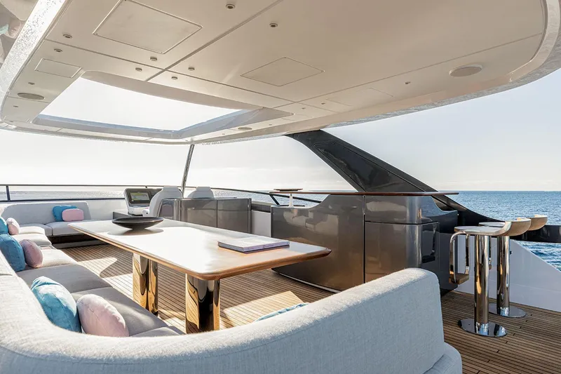 Slide: The Image of Luxurious Azimut Grande 26M yacht deck, 2025 model, featuring elegant seating and ocean views. - 39