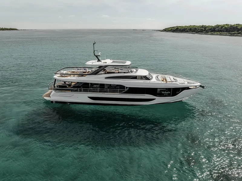 Slide: The Image of 2025 Azimut Grande 26M yacht on serene ocean waters. - 7