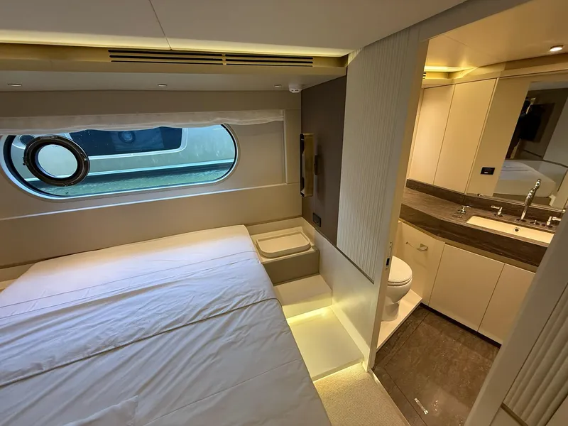 Slide: The Image of Luxurious interior of 2026 Azimut Magellano 25M yacht, featuring a bedroom and bathroom. - 10