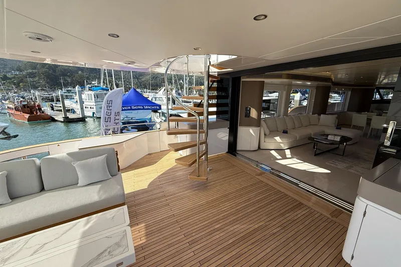 Slide: The Image of Luxurious 2026 Azimut Magellano 25M yacht interior with elegant seating and spiral staircase. - 101