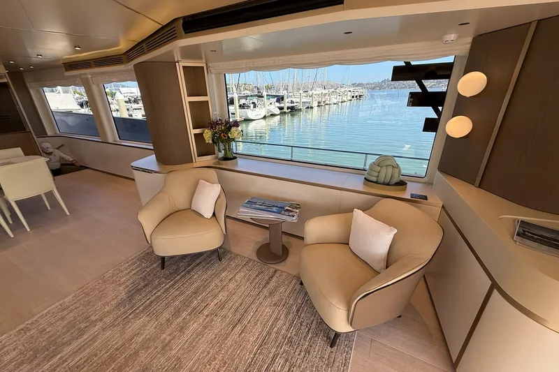 Slide: The Image of Luxurious interior of 2026 Azimut Magellano 25M yacht with elegant seating and marina view. - 103