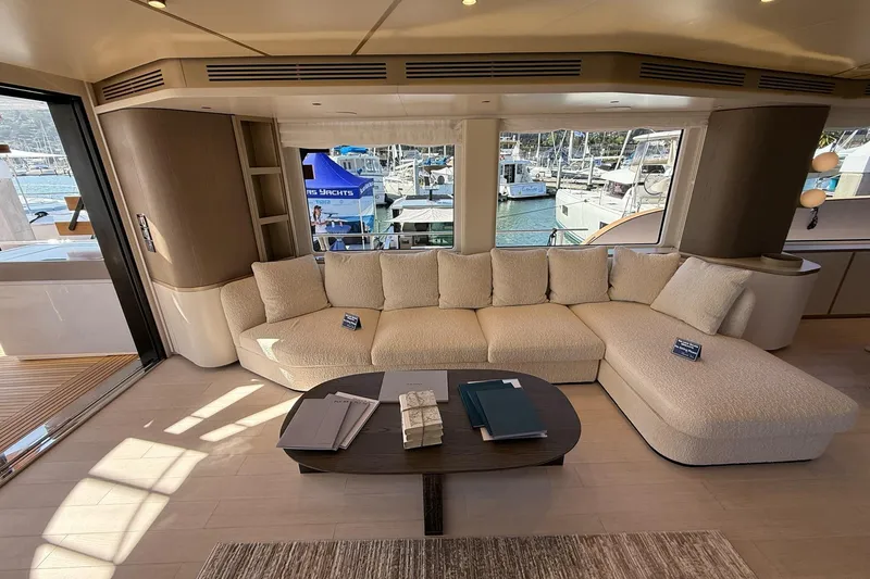 Slide: The Image of Luxurious interior of 2026 Azimut Magellano 25M yacht with elegant seating and marina view. - 104