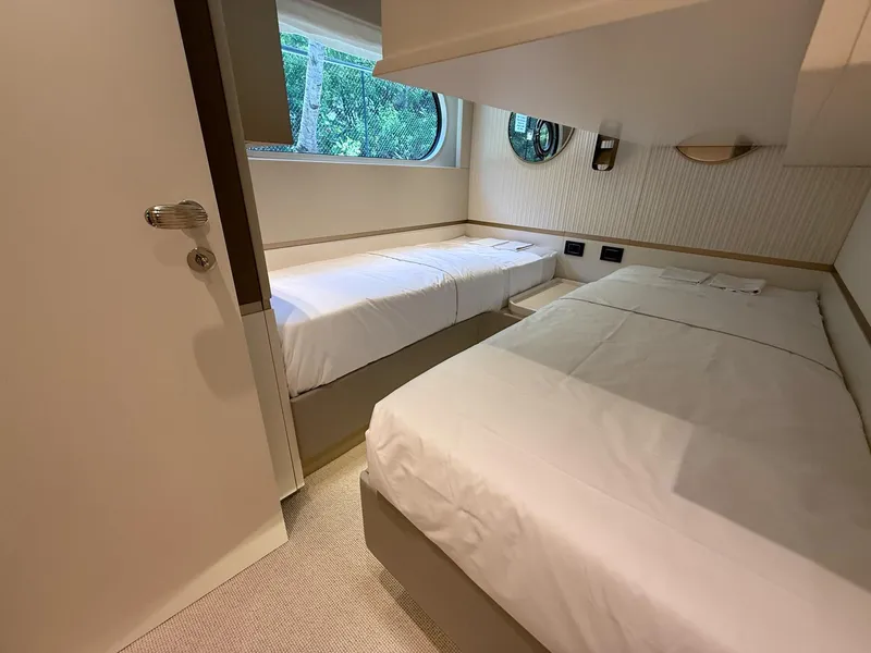 Slide: The Image of Luxurious twin cabin interior on 2026 Azimut Magellano 25M yacht. - 12